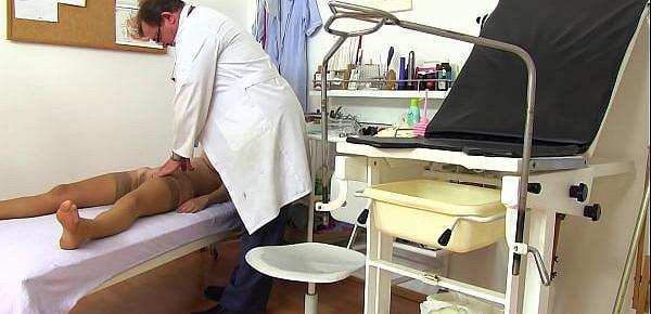 Spycam recording of naked young MILF on her gyno exam